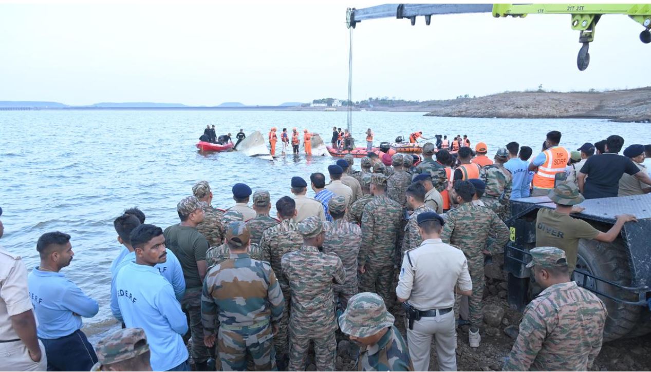Rescue workers at the site of a cruise boat tragedy where a mother and son were found together.